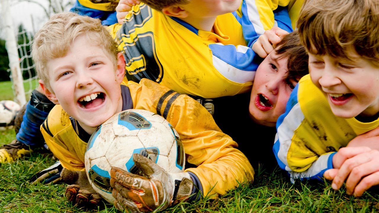 Walgreens Photography: Boys Soccer Team Rolling On Ground